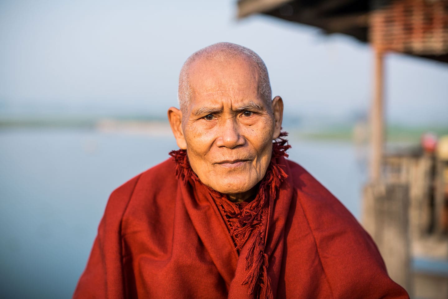 Old monk at the U Bein Bridge in Mandalay, Myanmar