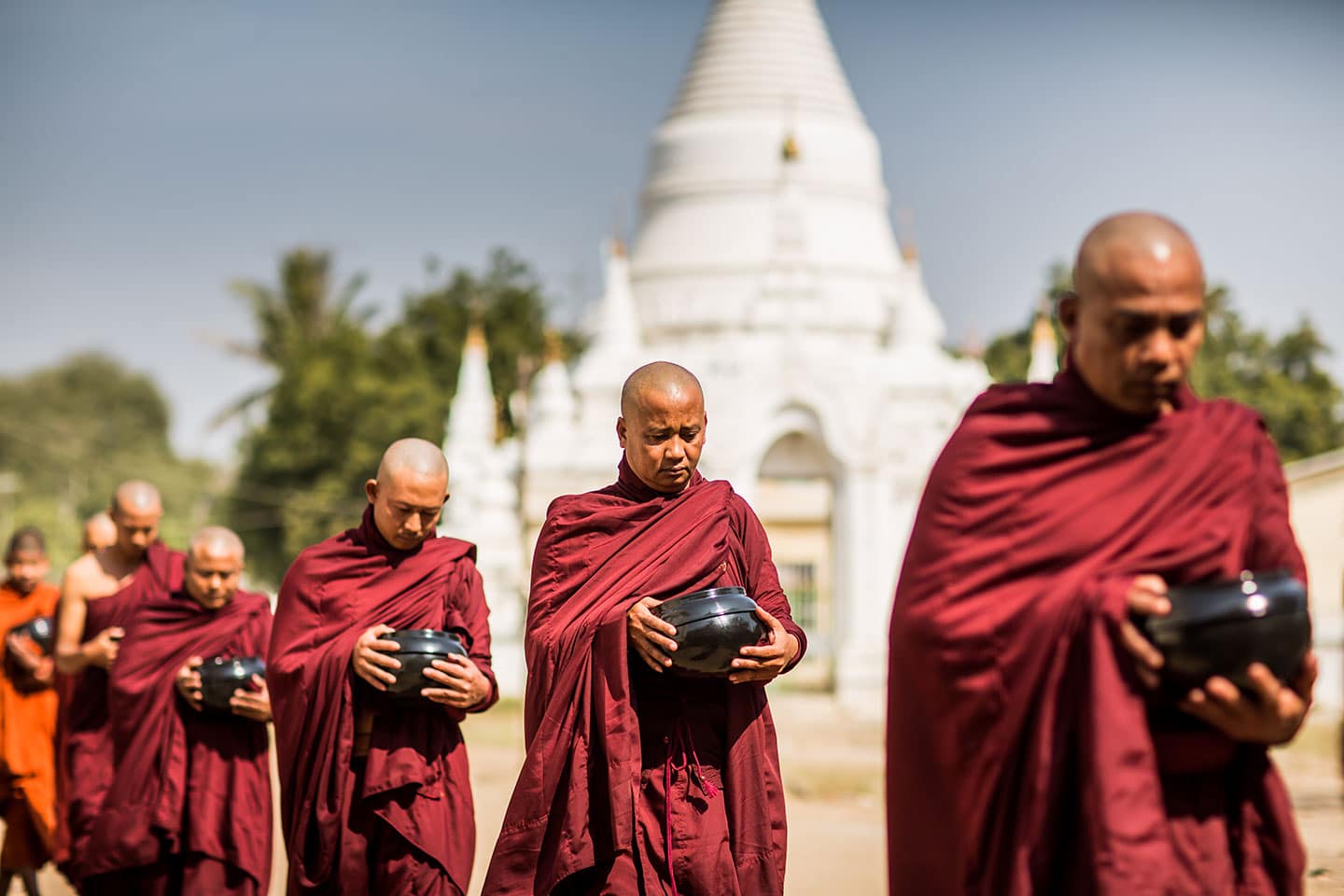 Monks at a white temple in Bagan, Myanmar