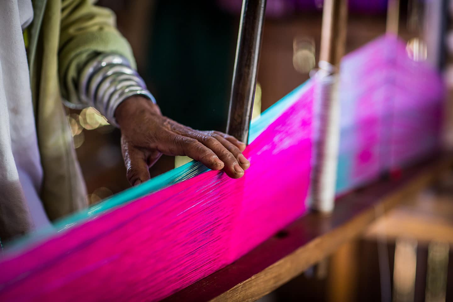 Woman weaving cloth in Myanmar