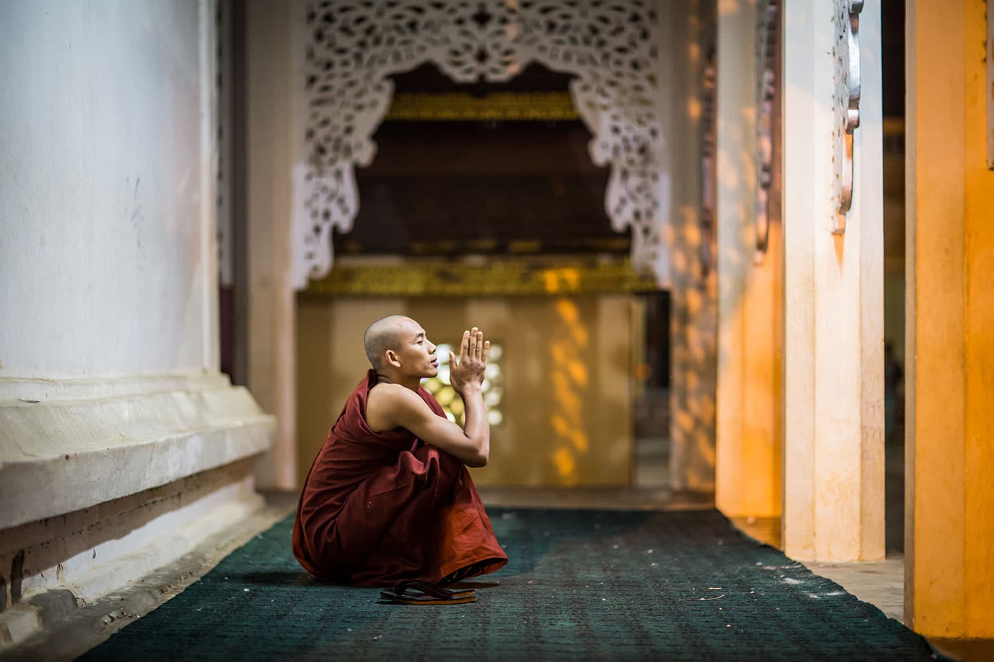 Monk praying at a temple in Old Bagan, Myanmar