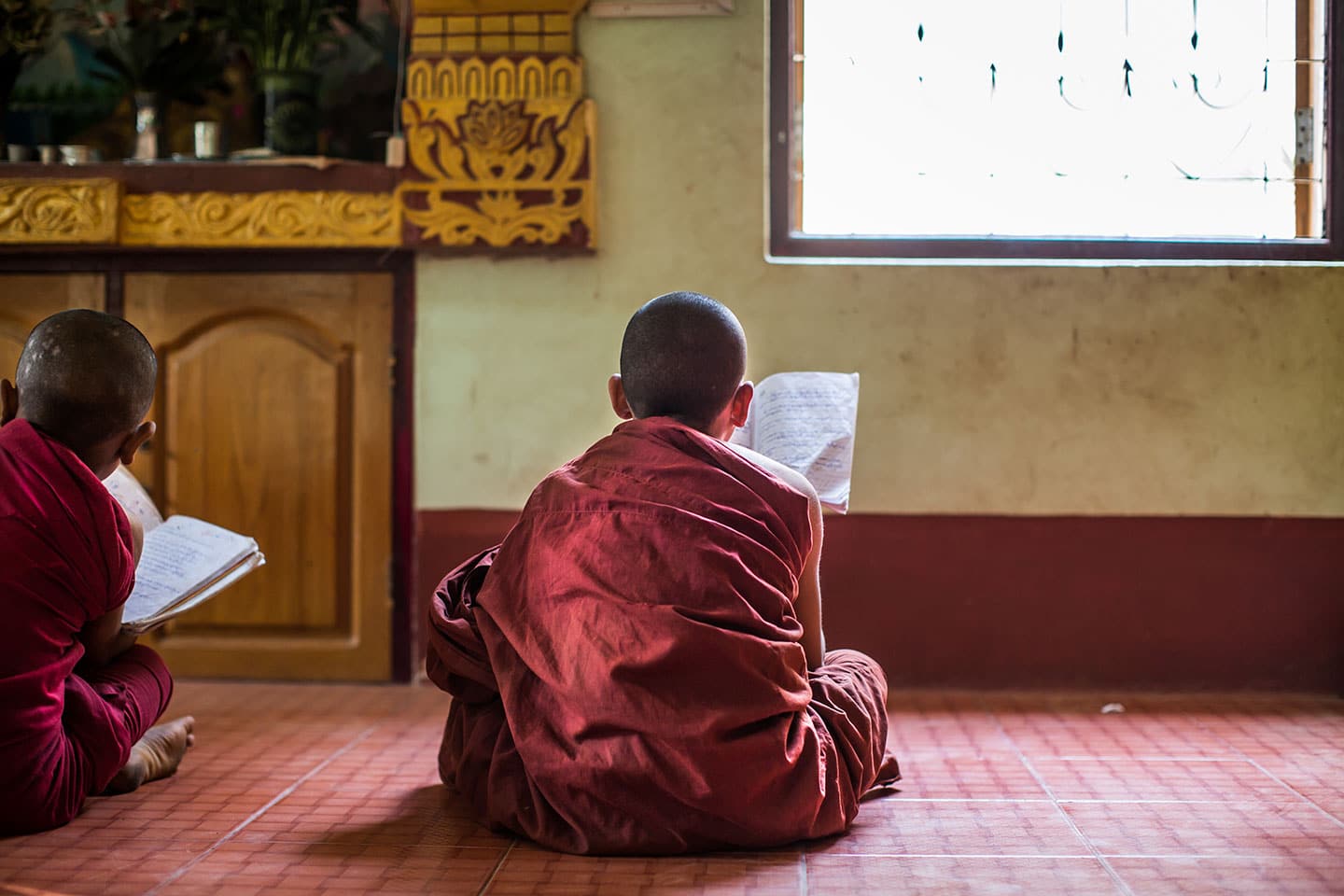 Young monks praying at a school in Myanmar