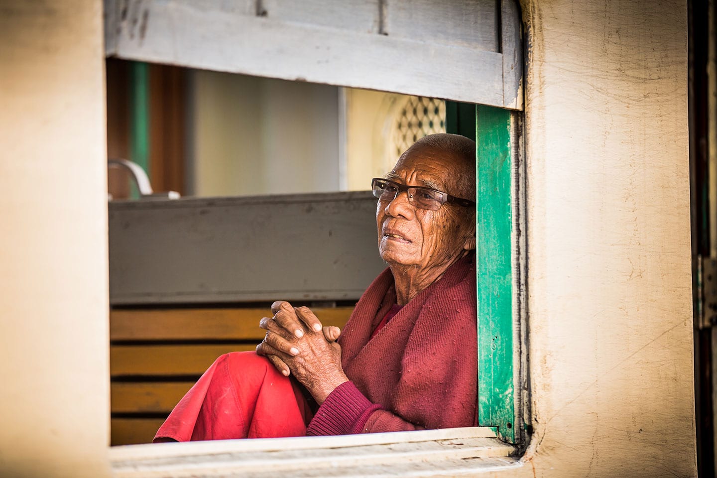 Old man on a train in Myamar