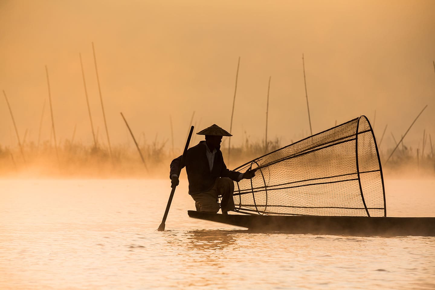 Fishermen at sunrise on Inle Lake in Myanmar