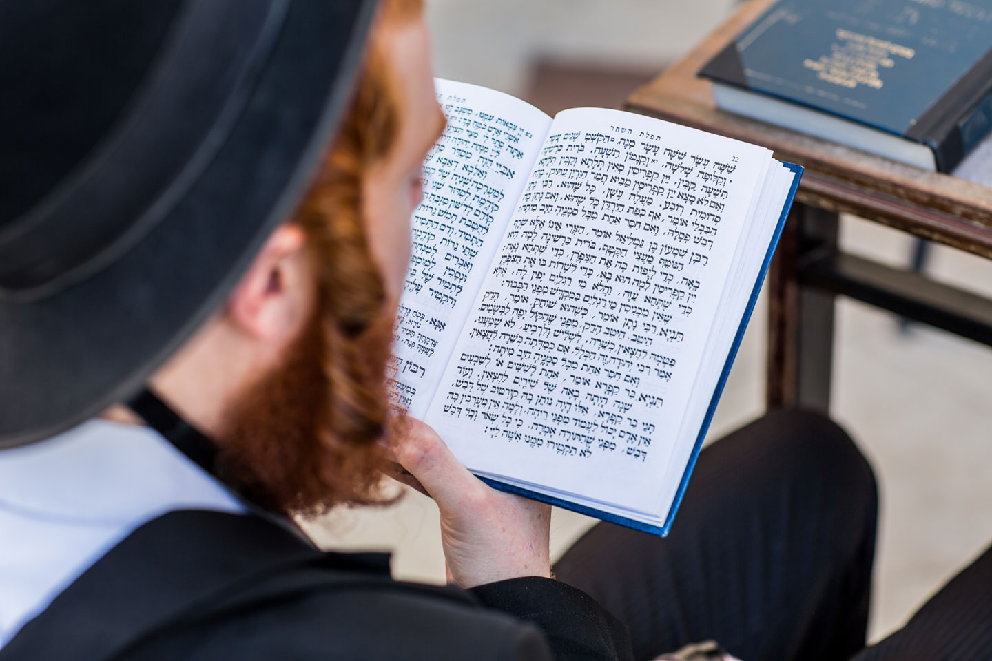 Orthodox jew reading the torah at the Western wall in Jerusalem, Israel