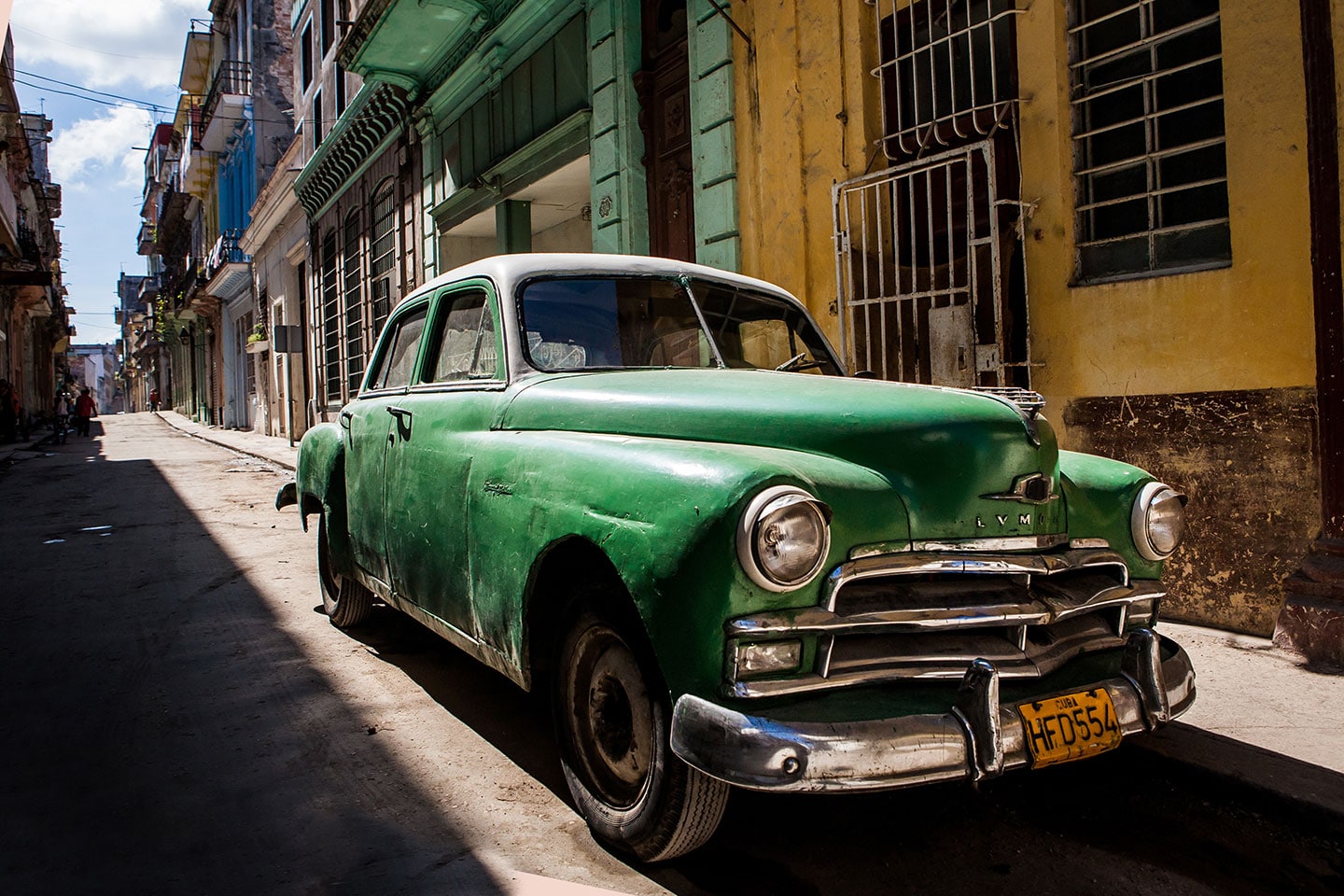 Havana, Cuba steet with old green vintage car