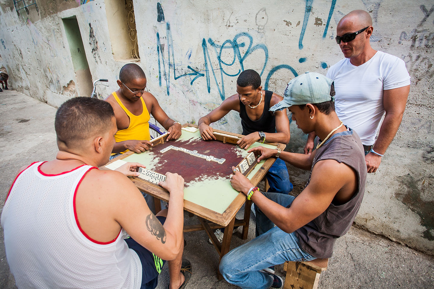 Men playing dominos in the streets of Havana, Cuba