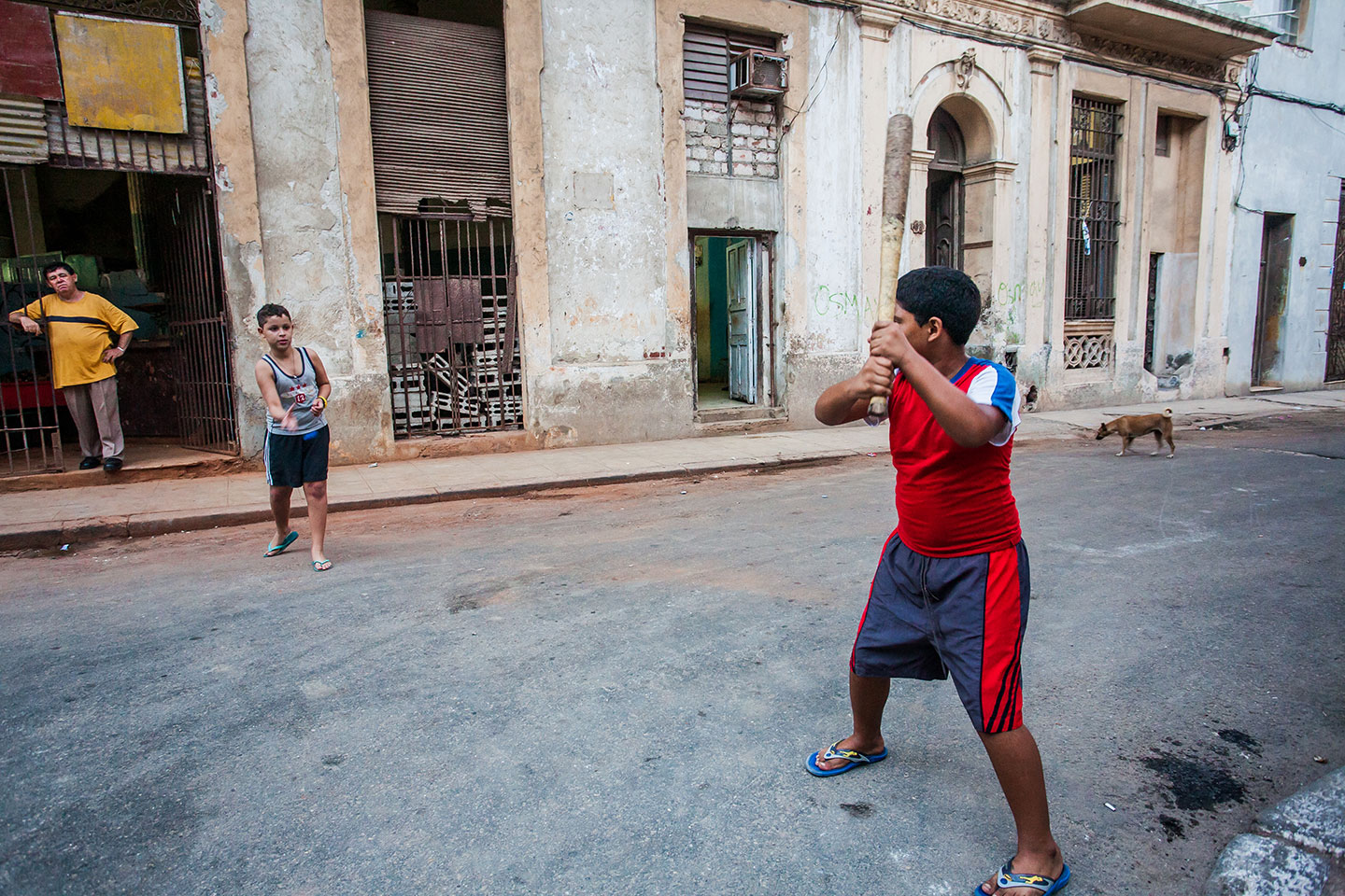 Kids playing baseball in the streets of Havana, Cuba