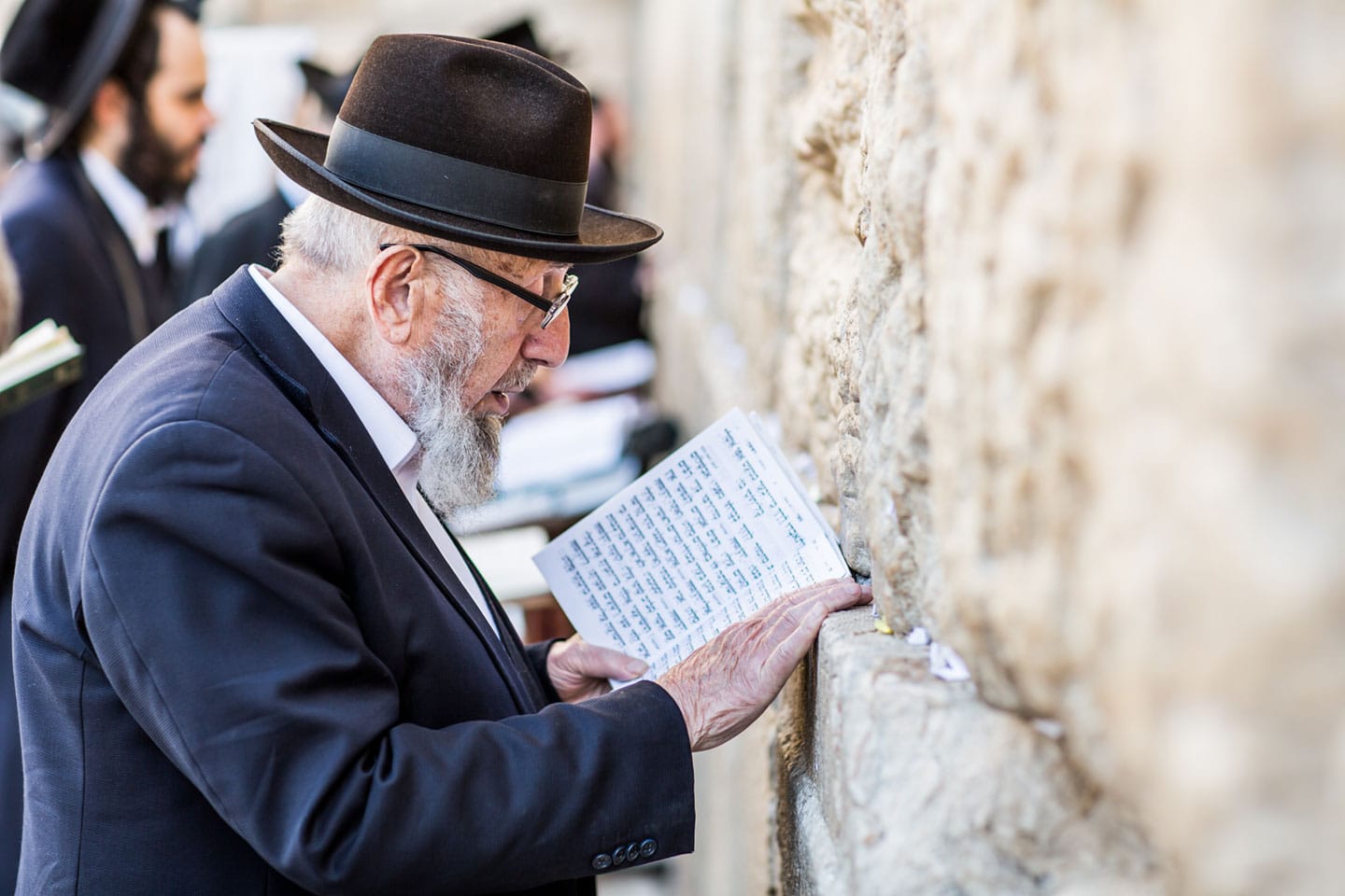 Jewish man reading the torah at the Western Wall of Jerusalem, Israel
