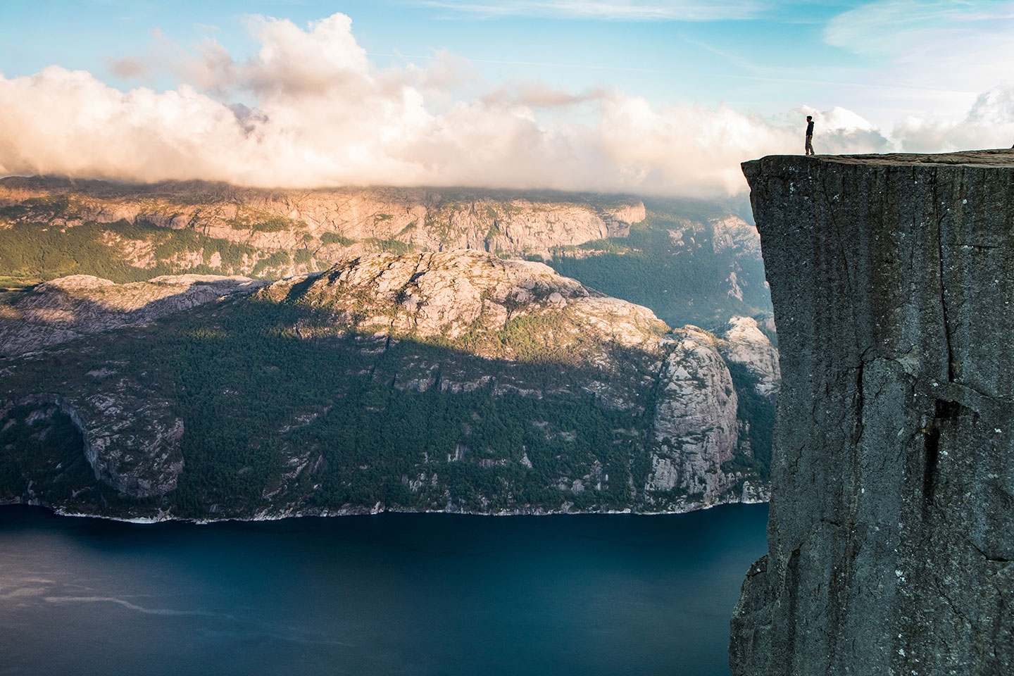 Tourist standing on Pulpit Rock in Norway