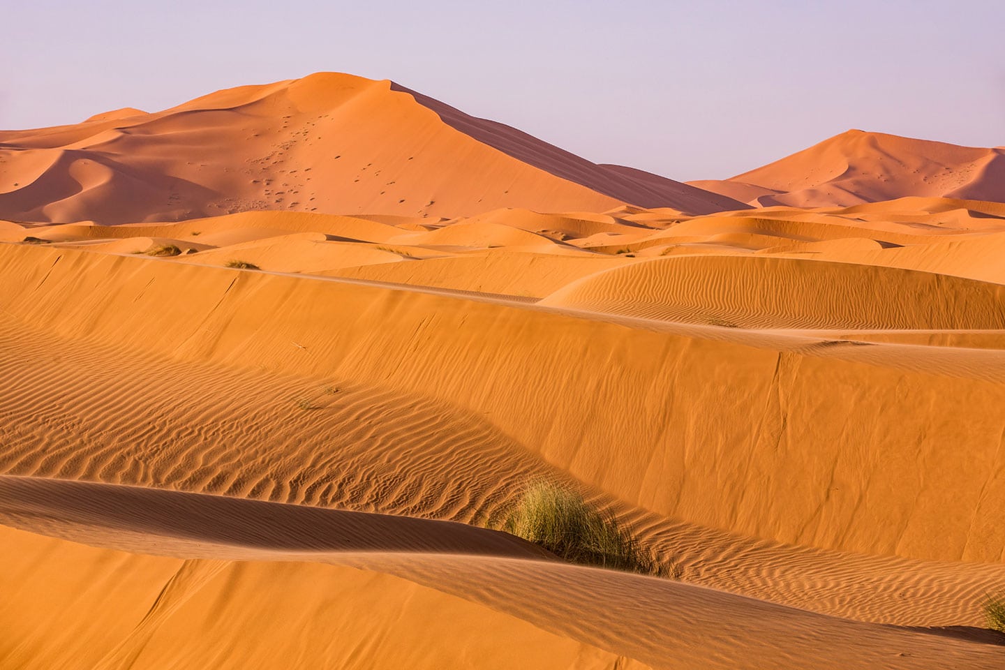Sunset over the sand dunes of the Sahara Desert in Morocco